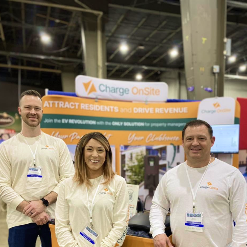 ChargeOnSite team at a trade show booth