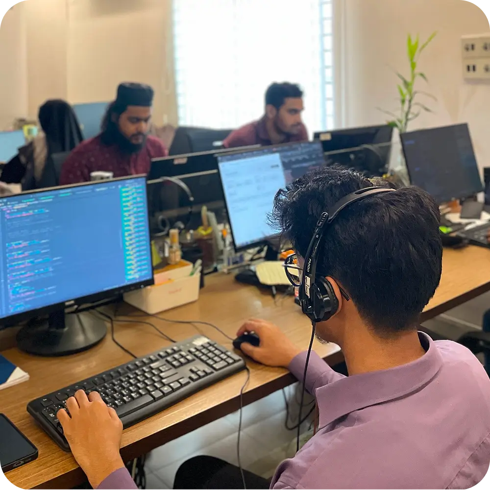 A senior dedicated development team working on a product together